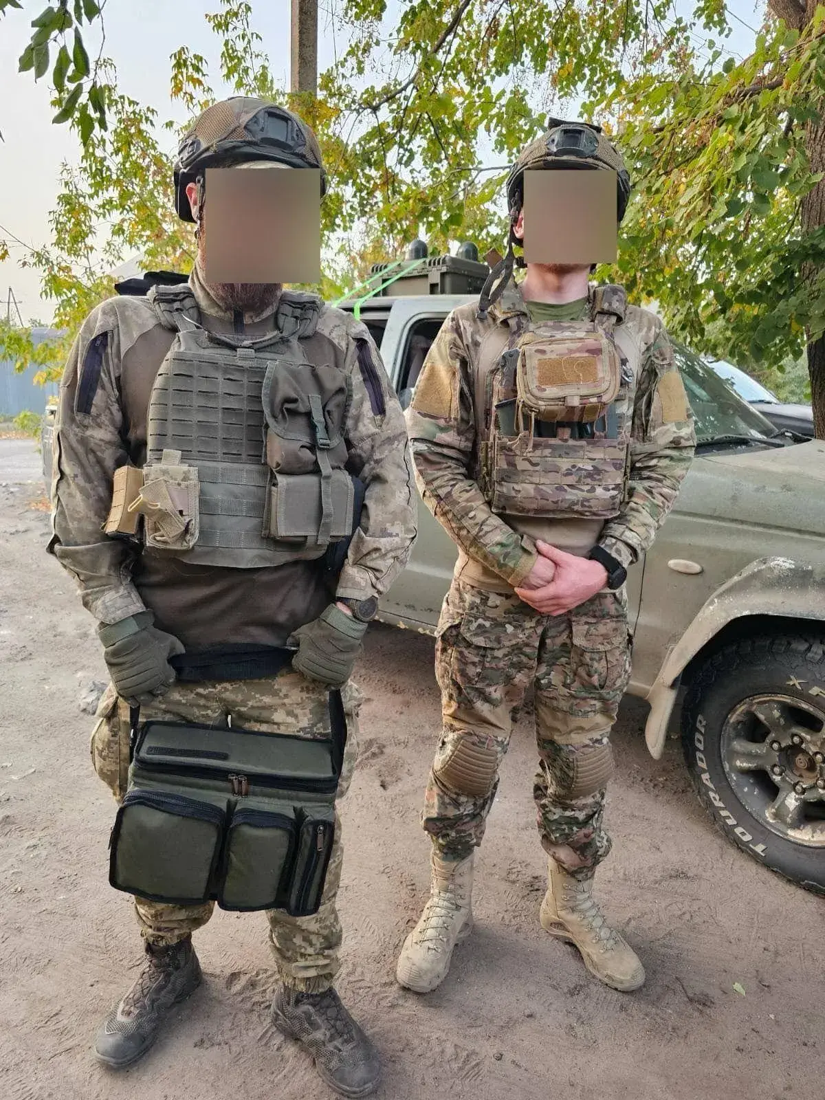 Two defenders share their thanks to UDS for a provided portable charging station